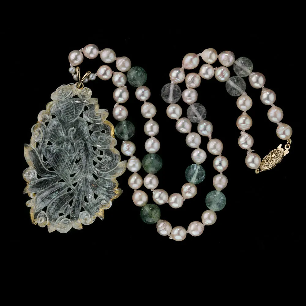 Aquamarine carved pendant with Japanese Akoya semi-baroque pearls and tourmaline beads. 18", 14kt. pdgm116