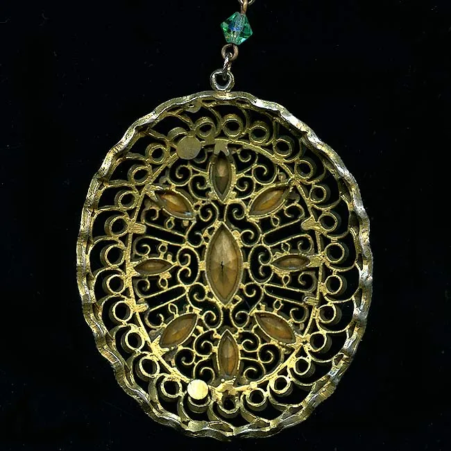 Edwardian brass filigree pendant with multi colored glass stones. j-pded072
